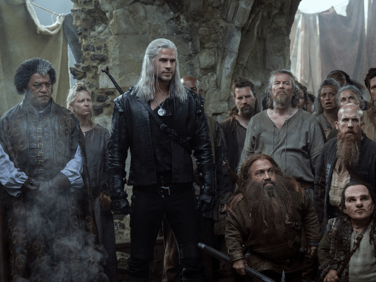 Lawrence Fishburn as Regis, Liam Hemsworth as Geralt, and Danny Woodburn as Zoltan in 'The Witcher'