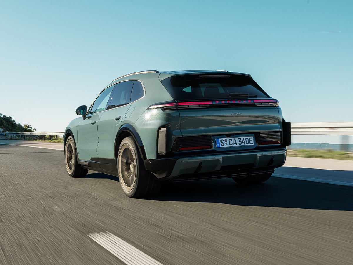 2026 porsche cayenne turbo electric rear three quarter on road 2