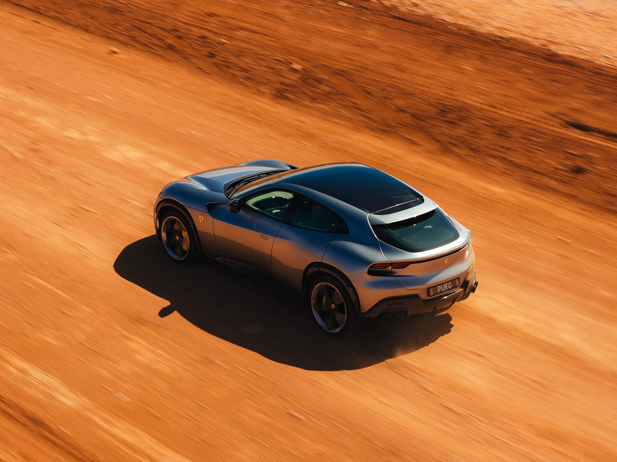 Ferrari purosangue review rear three quarter on dirt