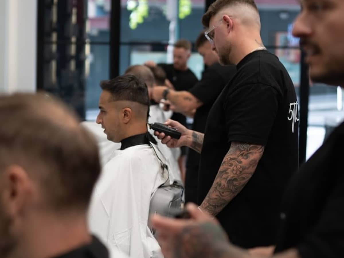 Barber at work at 5000 BC barbershop in Sydney