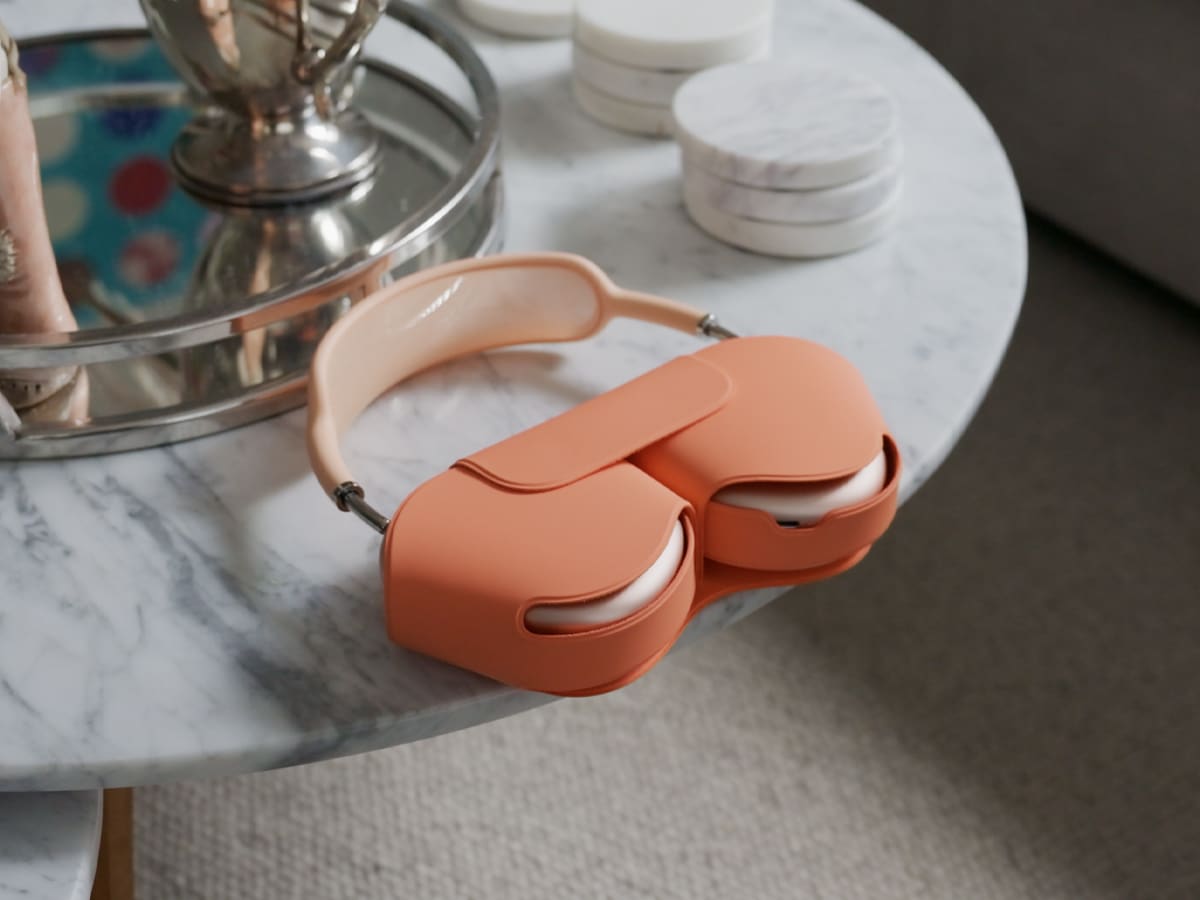 Airpods max 2 on table in case