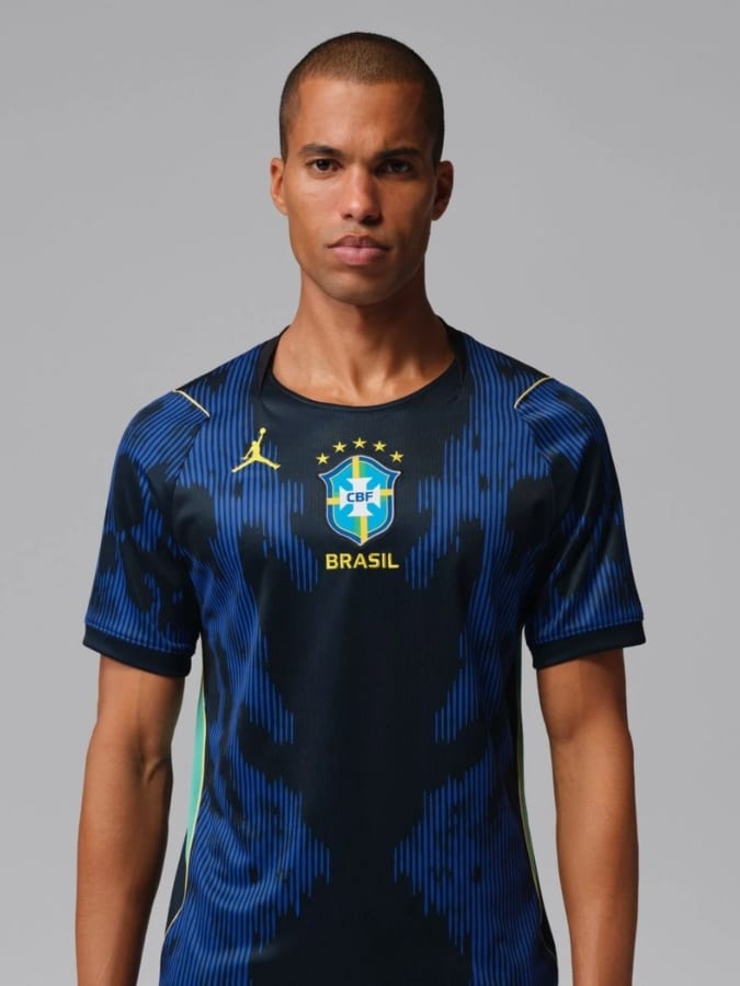 Brazil 2026 World Cup away jersey by Nike Jordan in navy blue with electric blue poison dart frog inspired graphics.