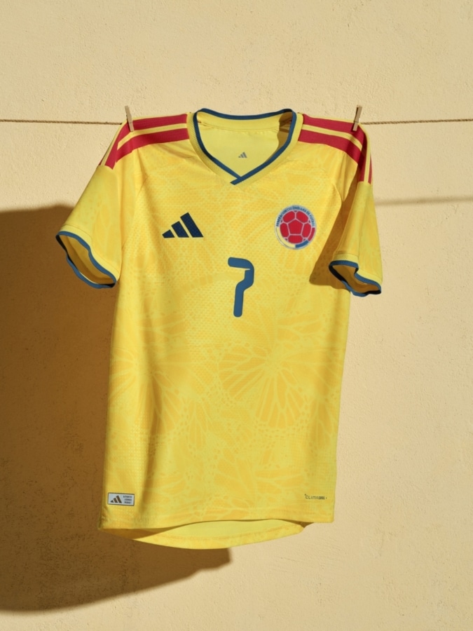 Colombia 2026 World Cup home shirt in traditional yellow with subtle butterfly graphics representing magical realism.
