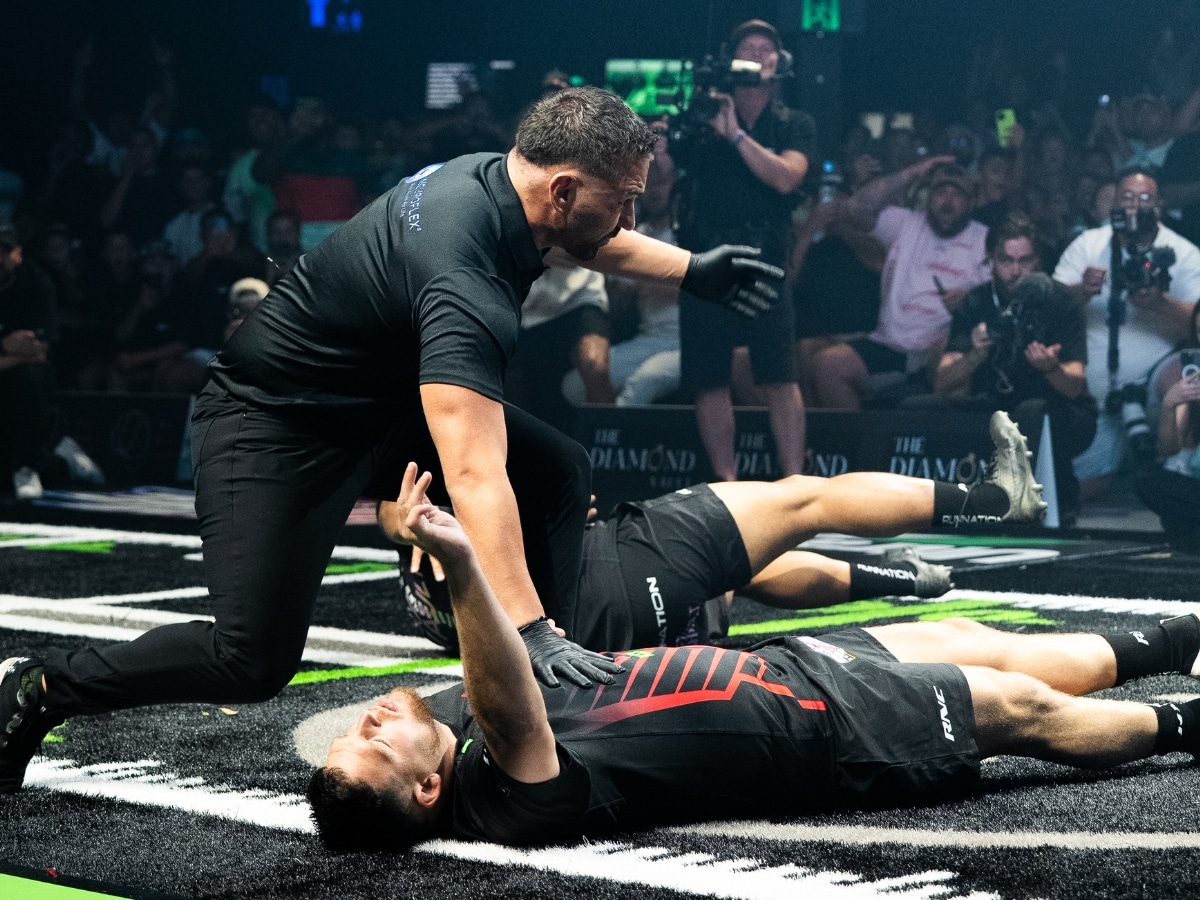A referee checks on a fallen-athlete. | Image: Supplied / Run Nation