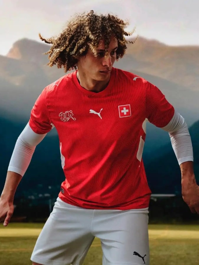 Switzerland 2026 World Cup home kit by Puma in classic red with a tonal geometric pattern based on the Swiss passport.