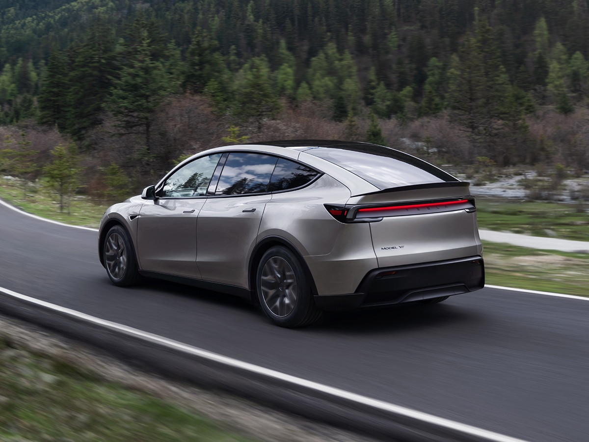 Tesla model y l on road rear three quarter