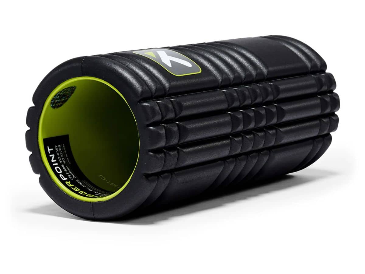 A black TriggerPoint Grid foam roller, featuring the distinct multi-density EVA foam surface in the "Grid" pattern over a rigid hollow core.