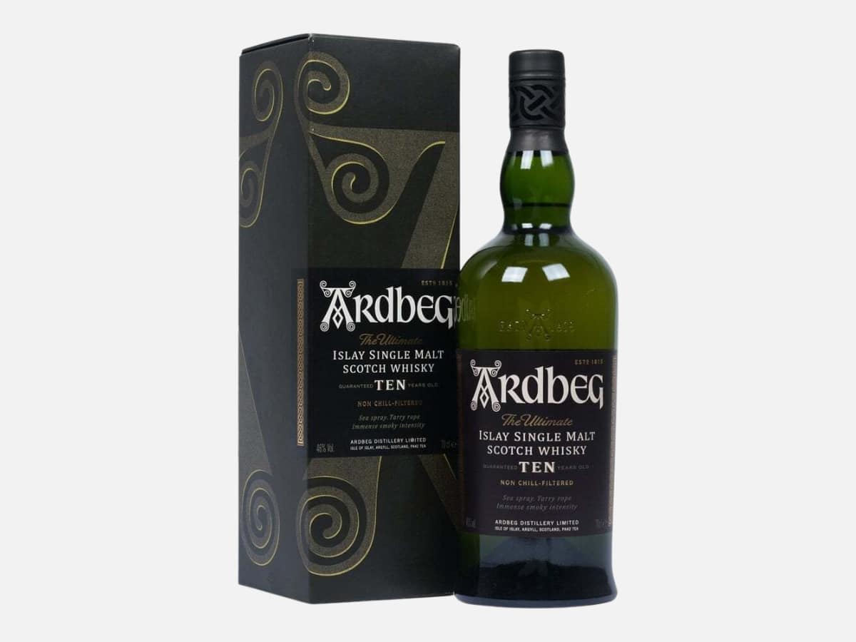 The iconic dark green bottle of Ardbeg 10 Year Old Islay Single Malt Scotch Whisky standing next to its textured green gift carton.