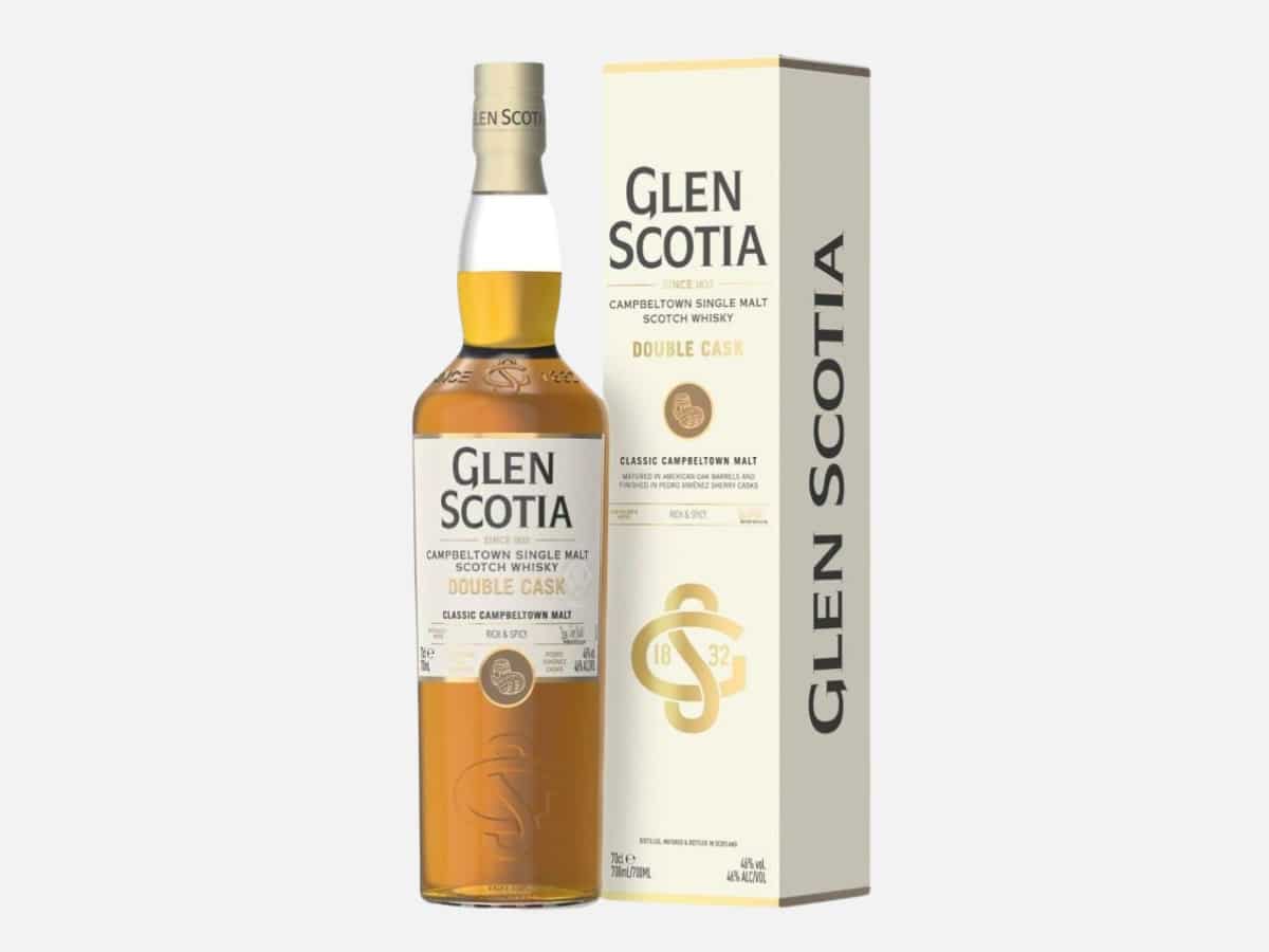 A front-on view of the Glen Scotia Double Cask Campbeltown Single Malt Scotch Whisky bottle next to its dark green and gold carton, featuring the region’s signature lighthouse imagery.