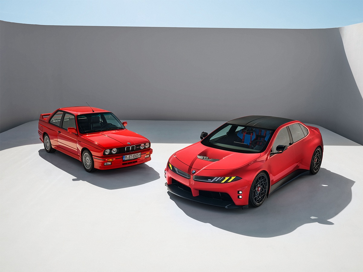 Two BMW M cars showcasing design evolution: classic red model and modern concept