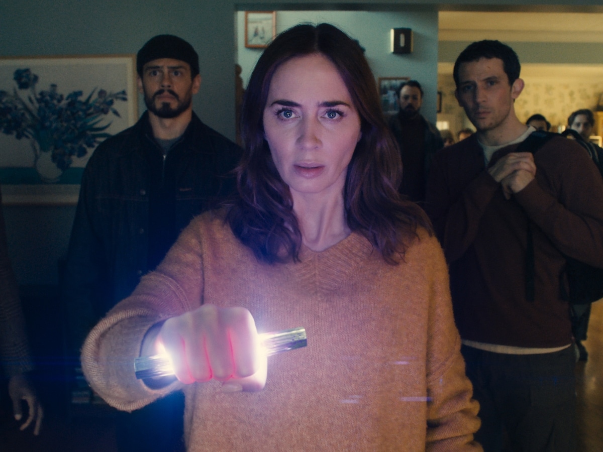 Emily Blunt as meteorologist Margaret Fairchild holding a weapon in Disclosure Day