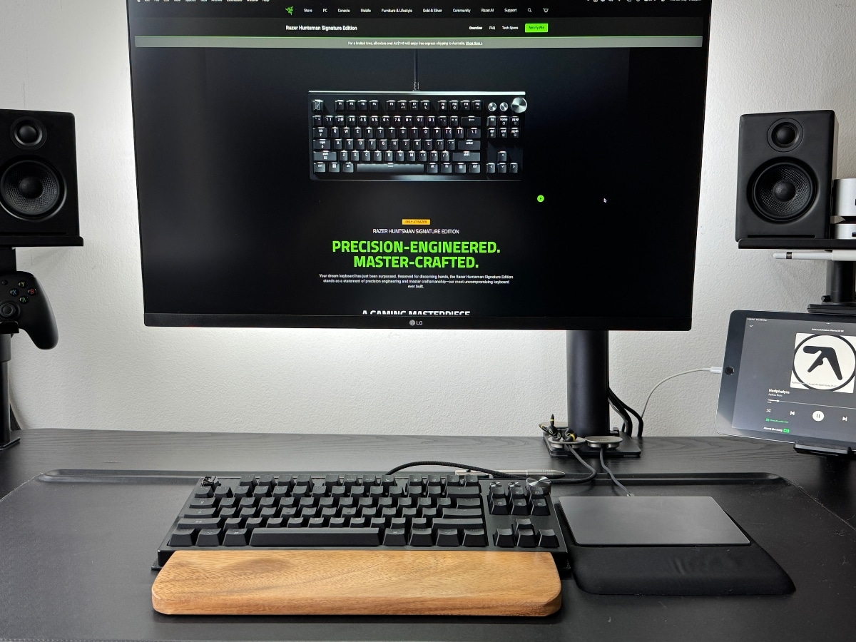 The Razer Huntsman Signature Edition being tested alongside a Mac workspace with custom keycaps.