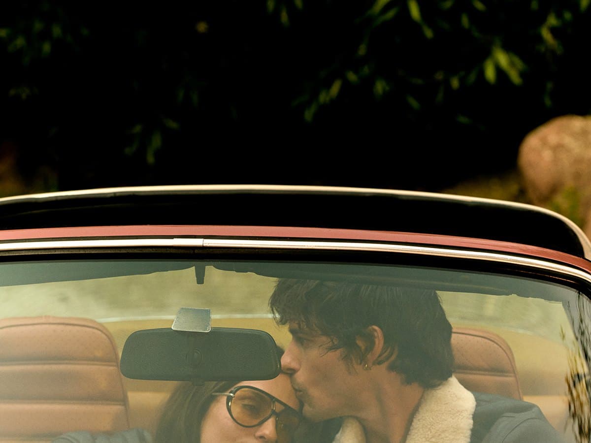 Two models in a vintage convertible during Calibre's The Weekender campaign