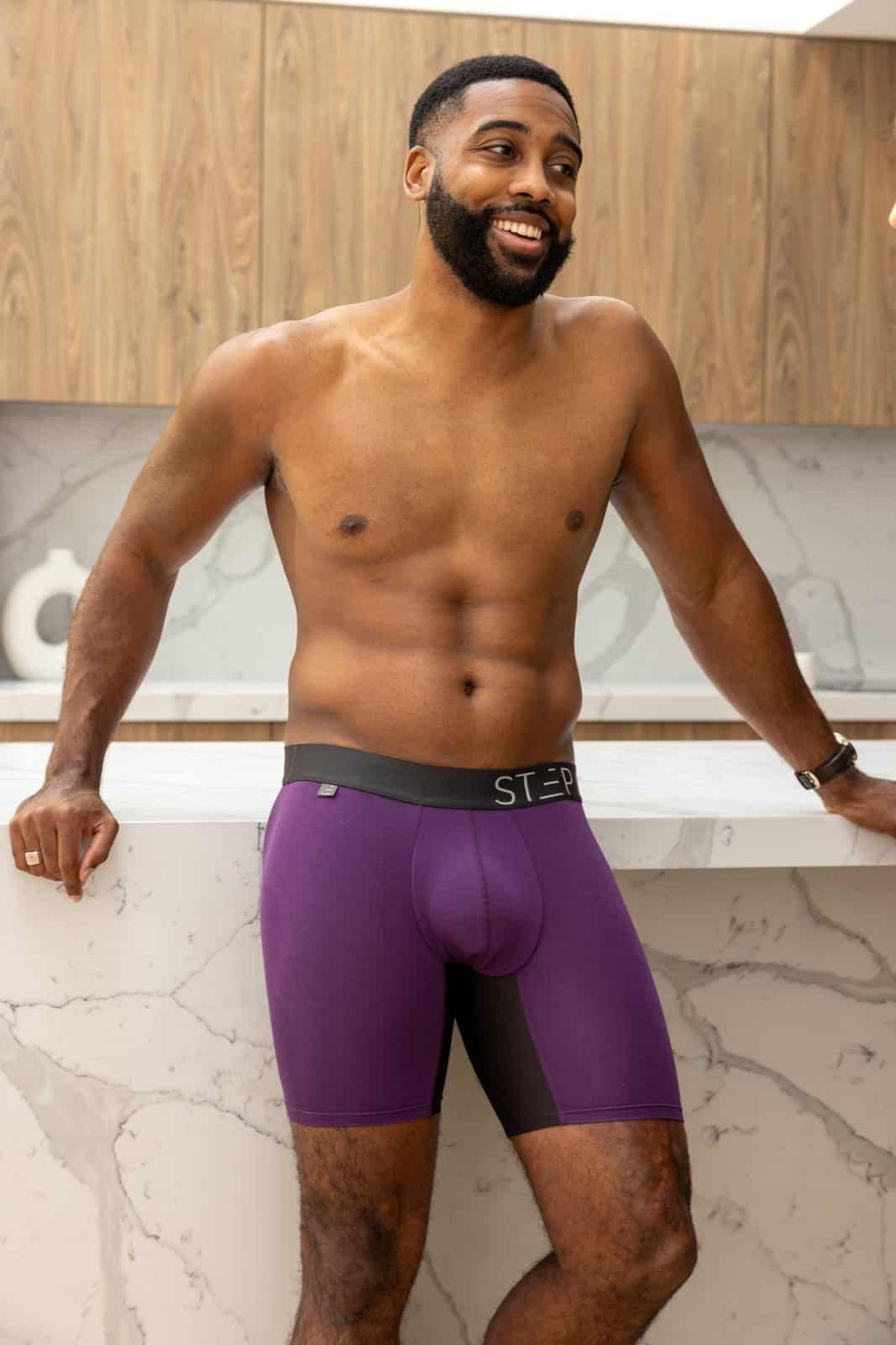 Man wearing purple Step One bamboo boxer briefs with no-chafe panels