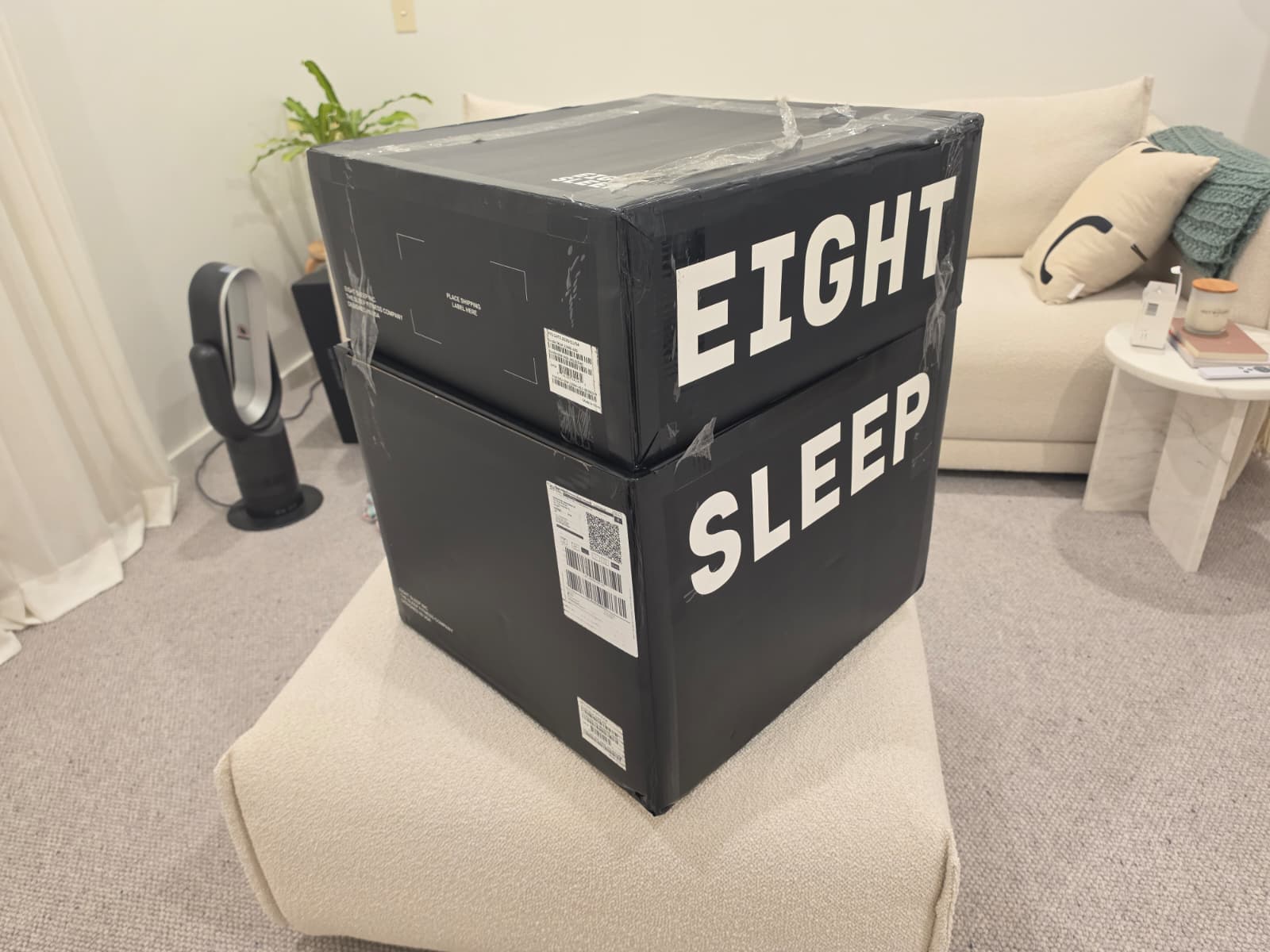 Opening the Eight Sleep Pod 5 box in a bedroom