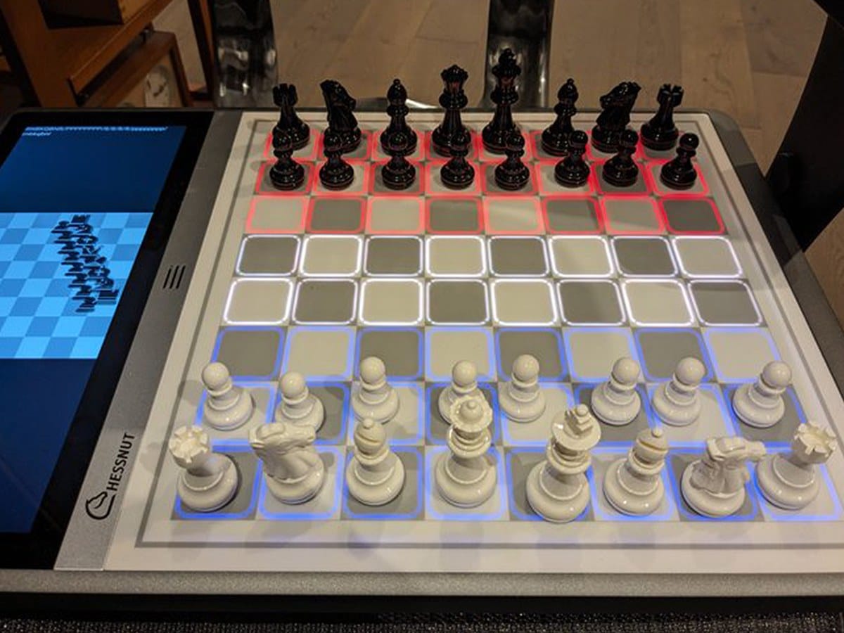 Chessnut Evo smart chess board with LED move highlights and built-in display during a game