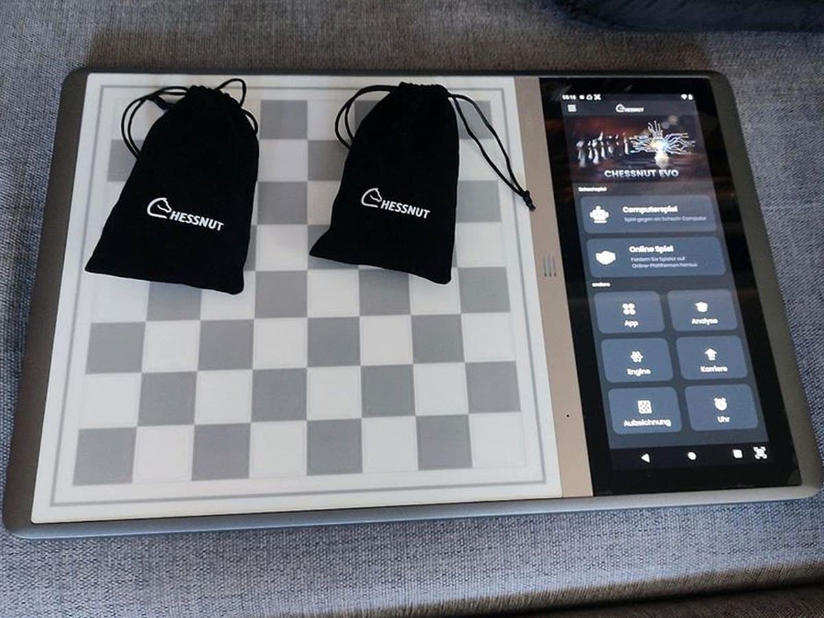Chessnut Evo board with included piece pouches and touchscreen display