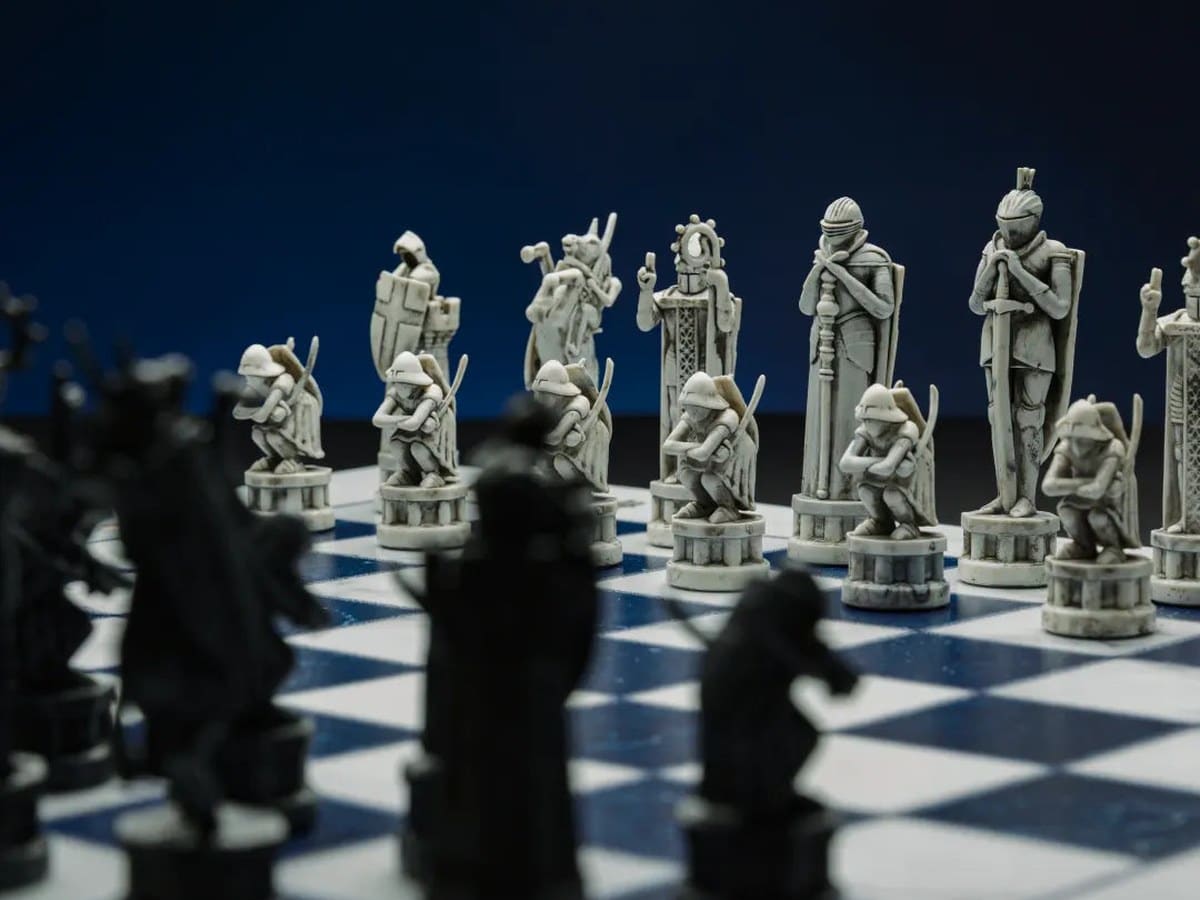 GoChess Wizard Lite sculpted Harry Potter chess pieces lined up on the board