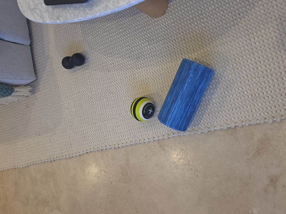 Recovery corner with massage roller, slides and mobility tools during Hyrox training