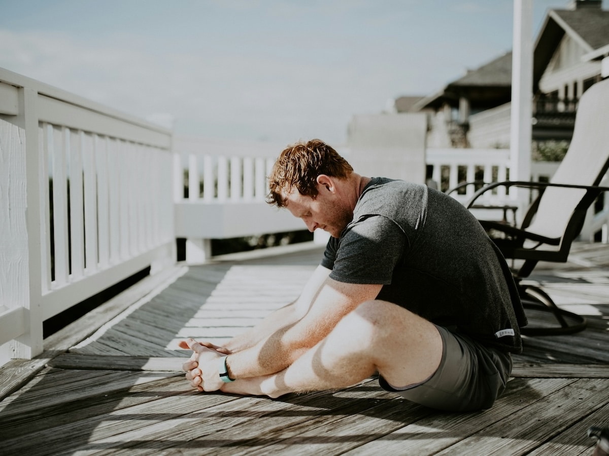 Man stretching in sun