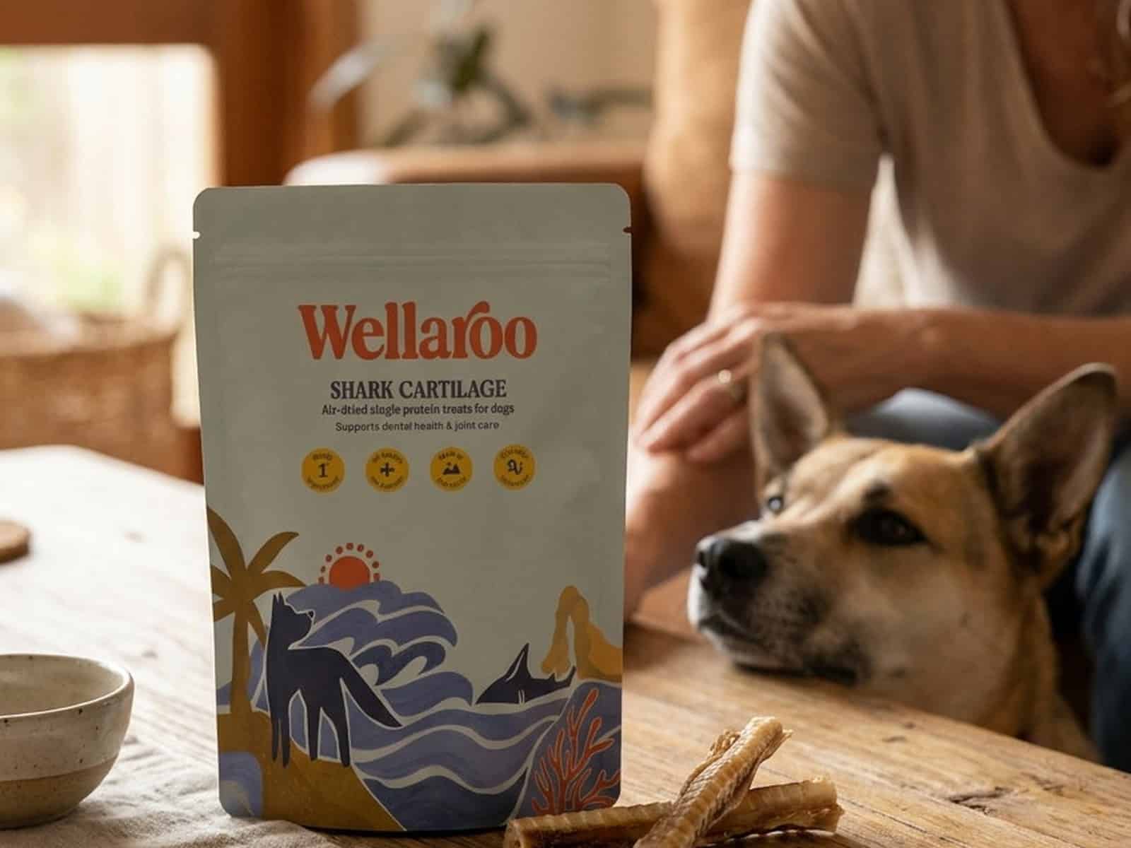 A pack of Wellaroo air-dried Australian shark cartilage dog treats beside a happy dog (6 of 6)