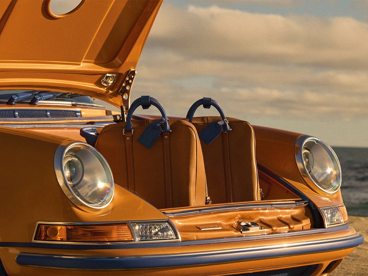 Porsche 911 reimagined by singer louis vuitton bag in trunk