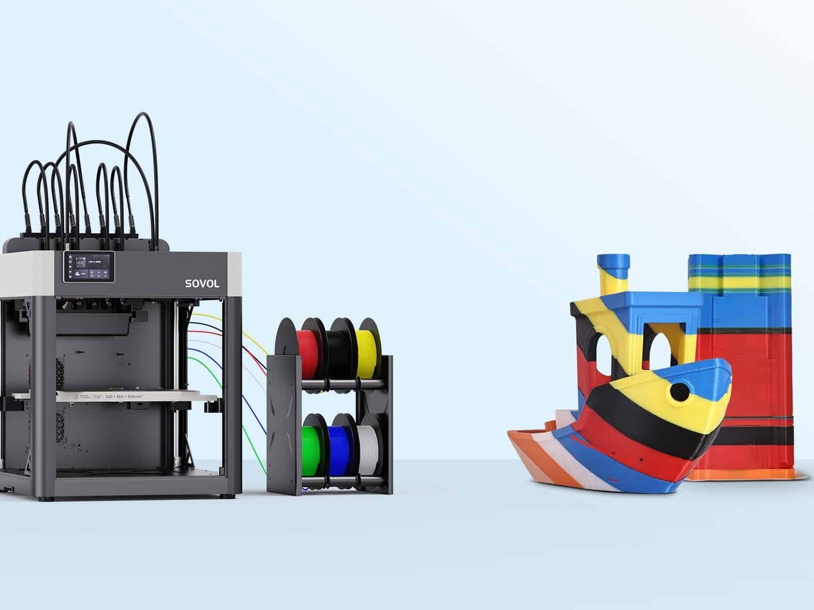 The Sovol M1D beside its six-spool filament unit, with two multi-colour prints