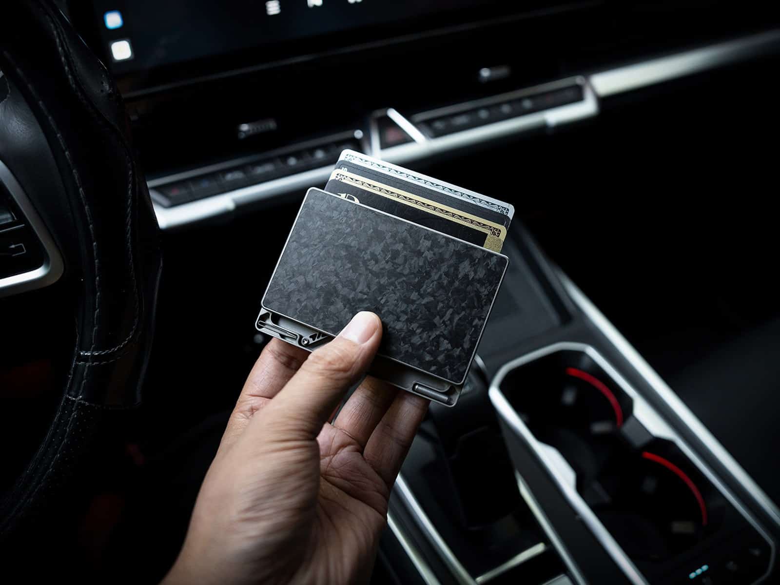 Titaner Verso Cards raised inside the car, one-handed