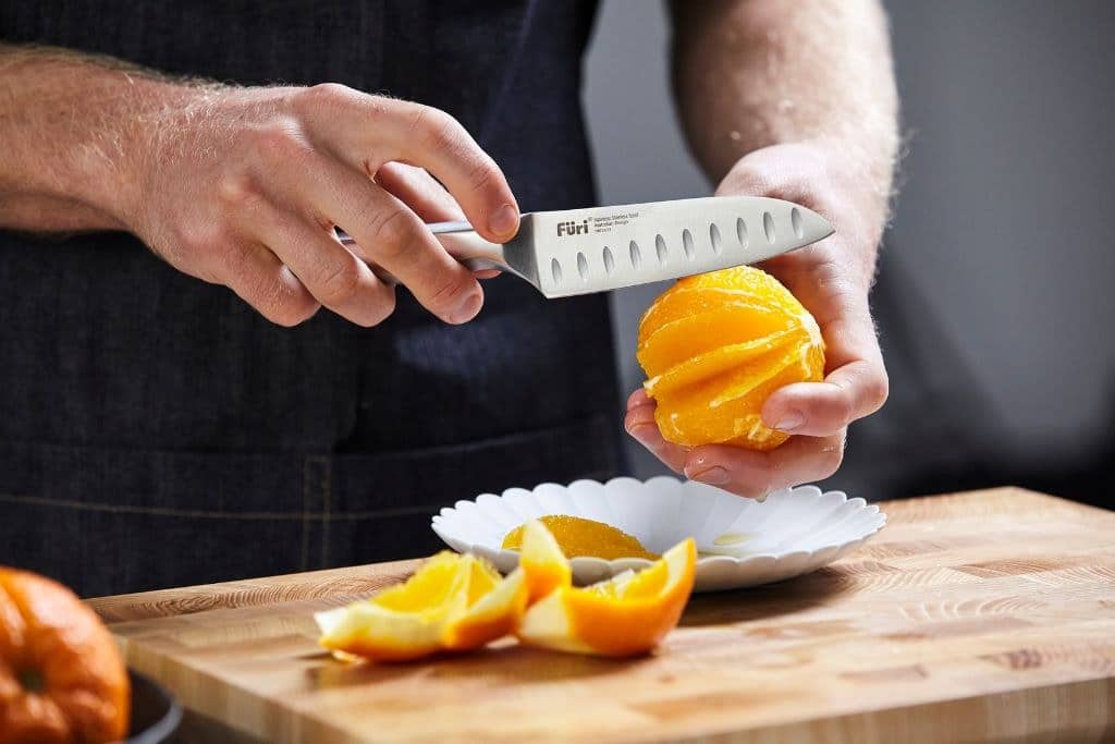 Segmenting an orange by hand with a Furi santoku knife