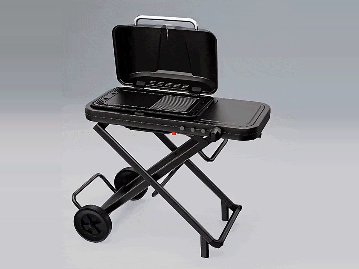 FYREL Fold & Go outdoor kitchen set up with the lid open, showing the grill and griddle plates, side prep table and folding X-frame trolley with wheels