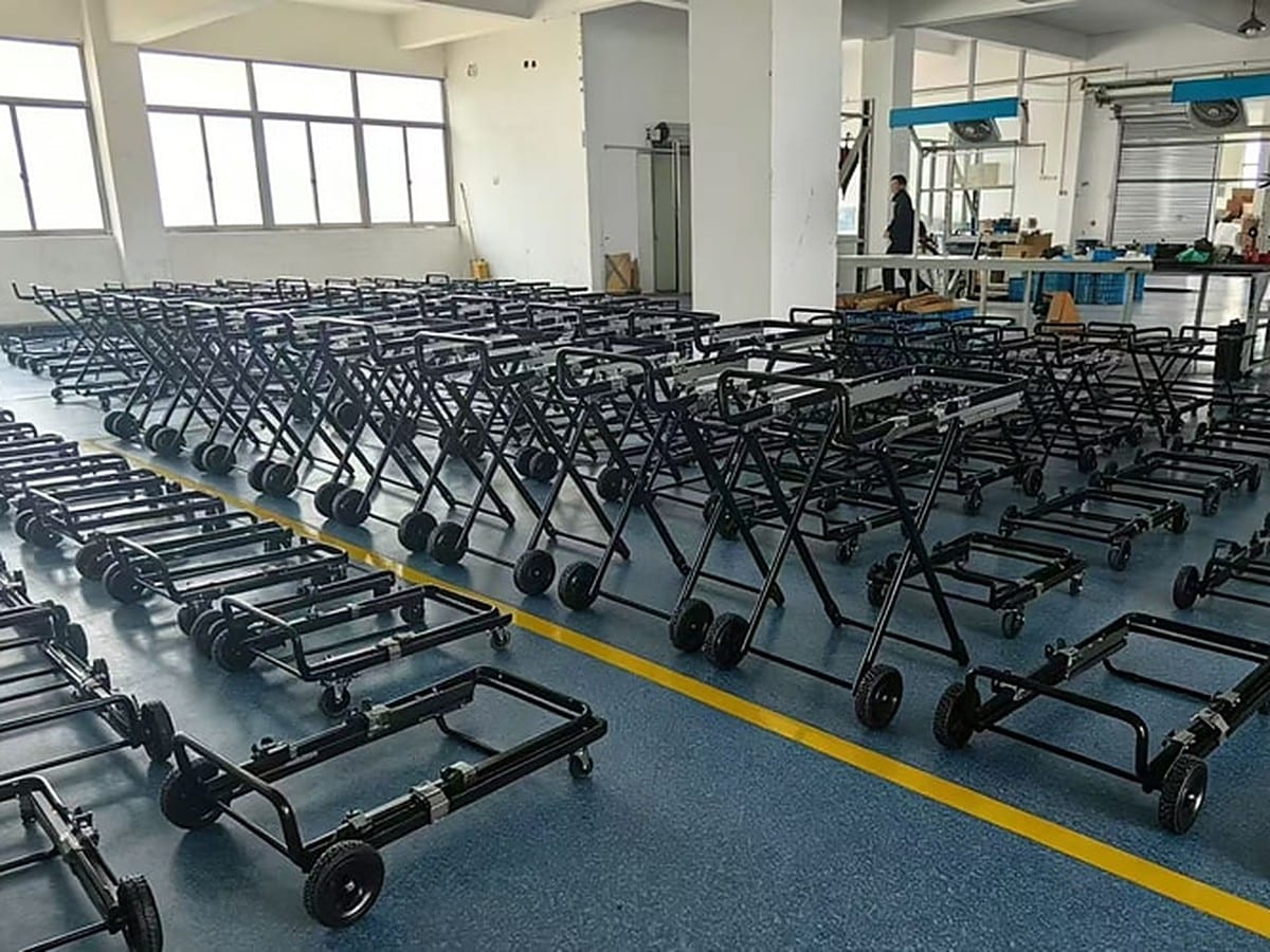 Rows of FYREL Fold & Go outdoor kitchen frames lined up on a factory floor during production
