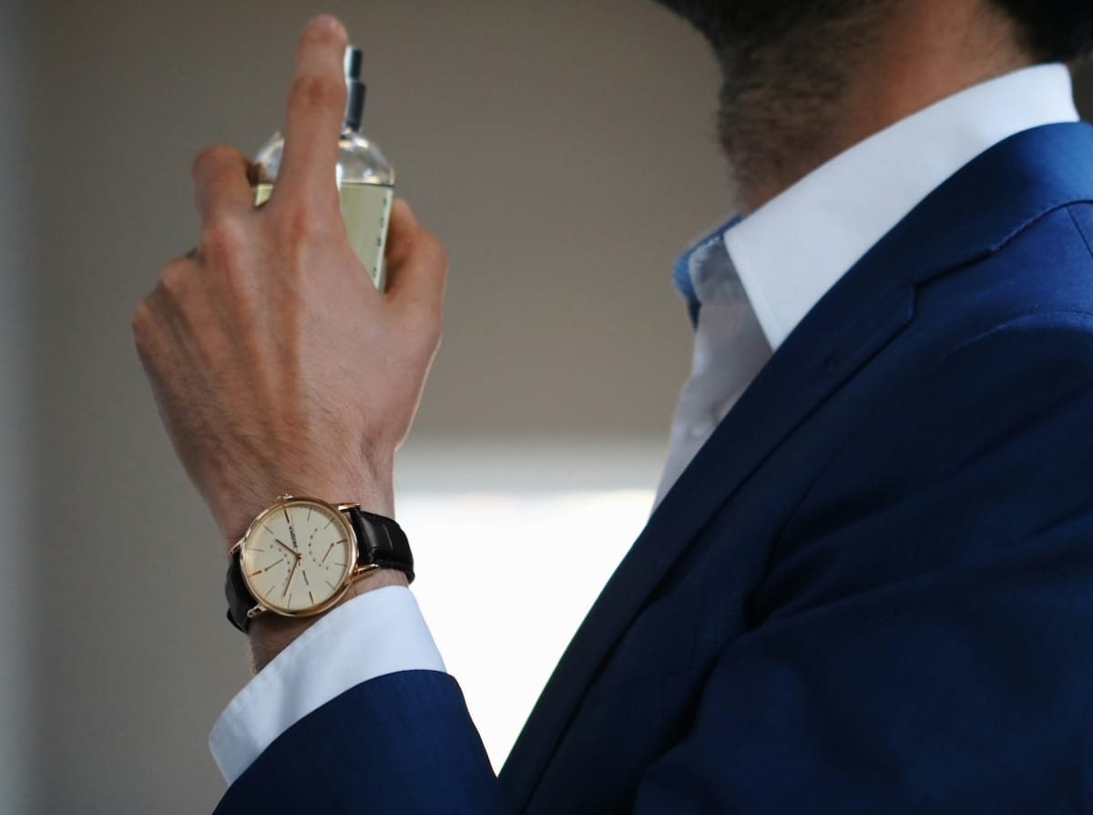 Man applying perfume