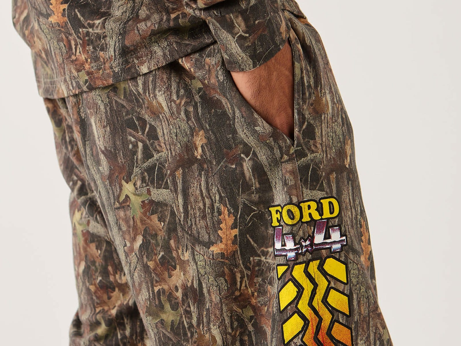Close-up of the Ford 4x4 tyre-tread graphic on the Chrome Sweatpant in Boxwood Green camo
