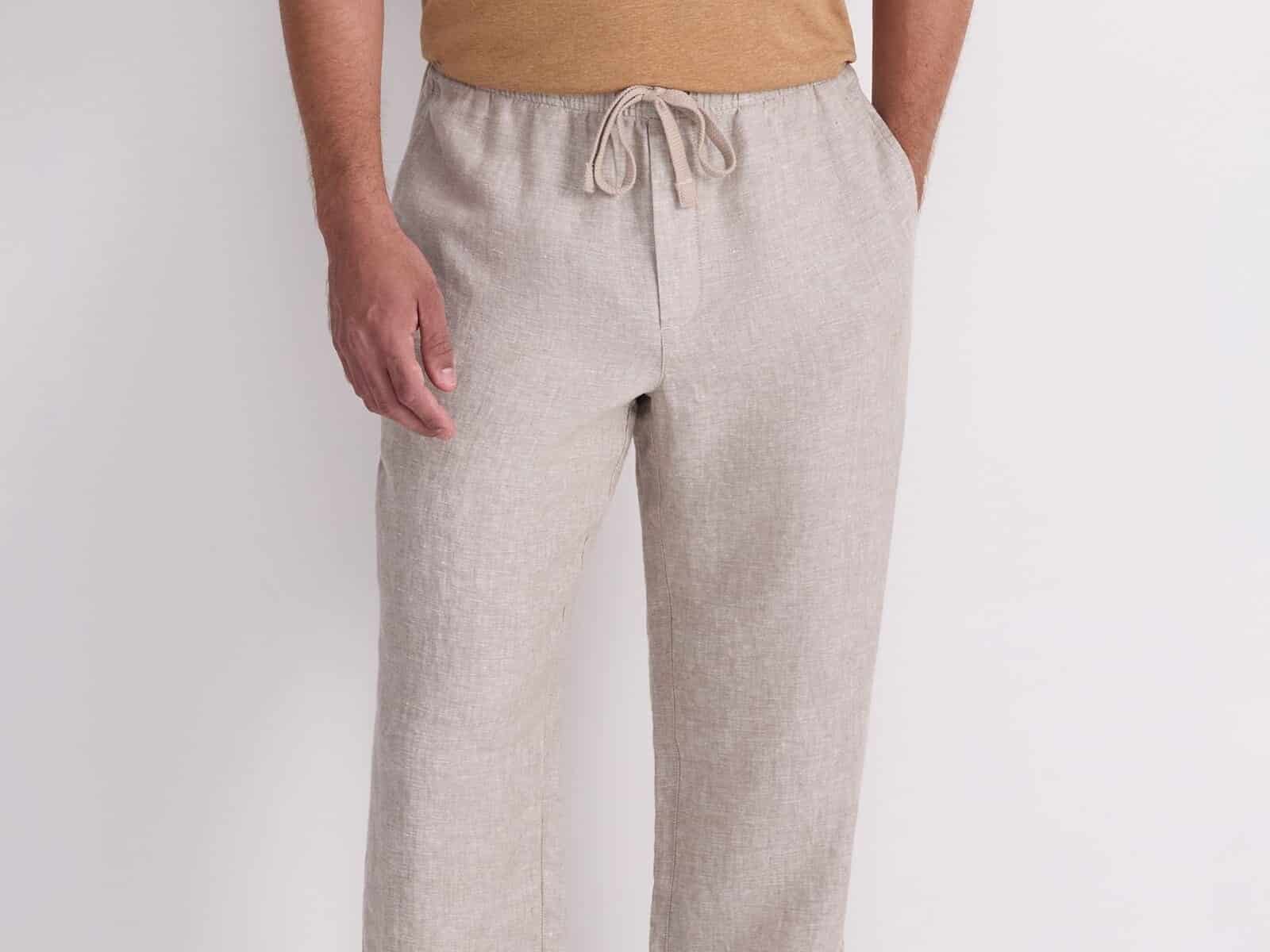 A man wearing the Sportscraft Caffery Yarn-Dyed Linen Pant in Cappuccino with suede slides