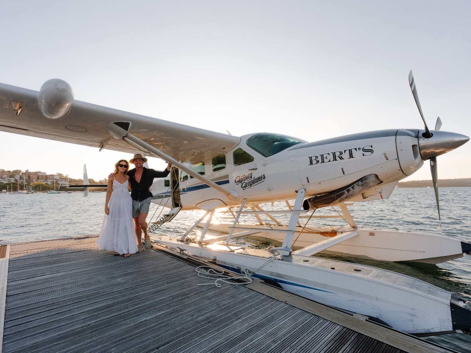 Guests stepping off a Sydney Seaplanes aircraft onto a wharf