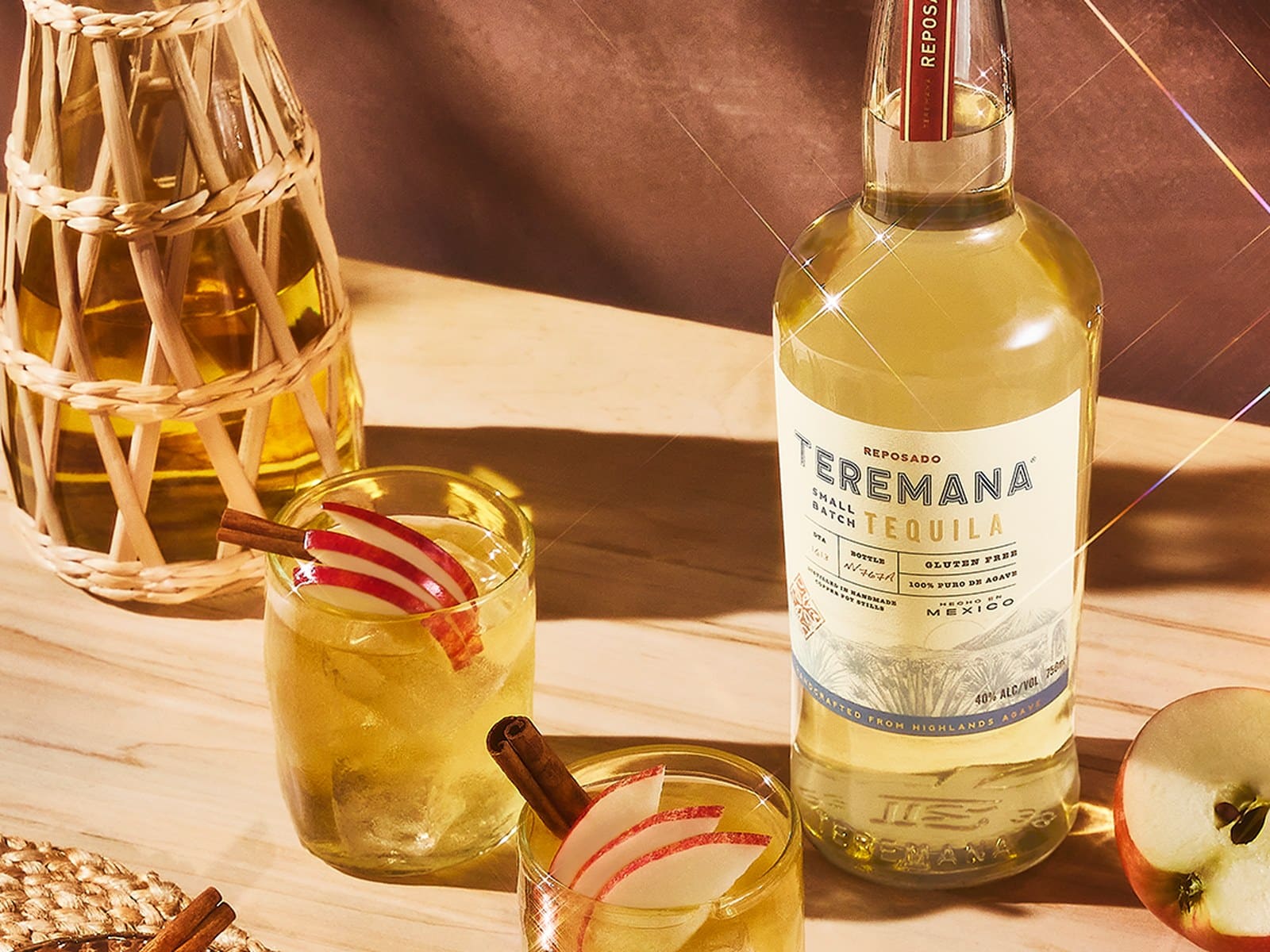 Three bottles of Teremana small batch tequila arranged together against a warm, earthy backdrop. (2 of 2)
