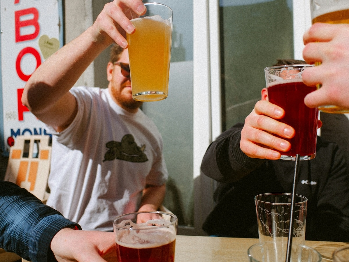 Guys drinking beer outdoors
