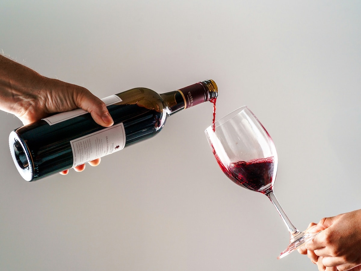 Pouring chilled red wine